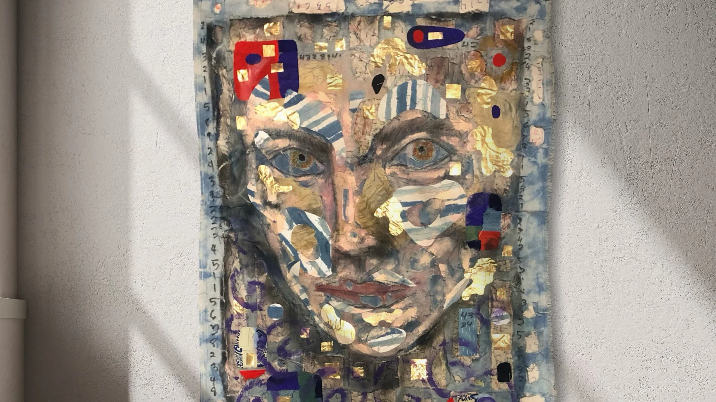 Portrait from a Window by Adam Cooley, boro textile artwork of a woman's face with blue eyes, featuring abstract shapes, gold accents, and numbers around the border.