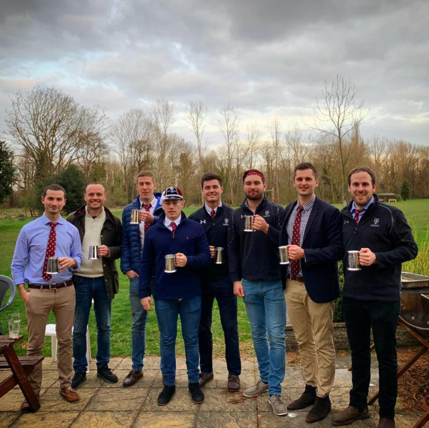 A group of the most capped OGRFC players holding their tankers in celebration