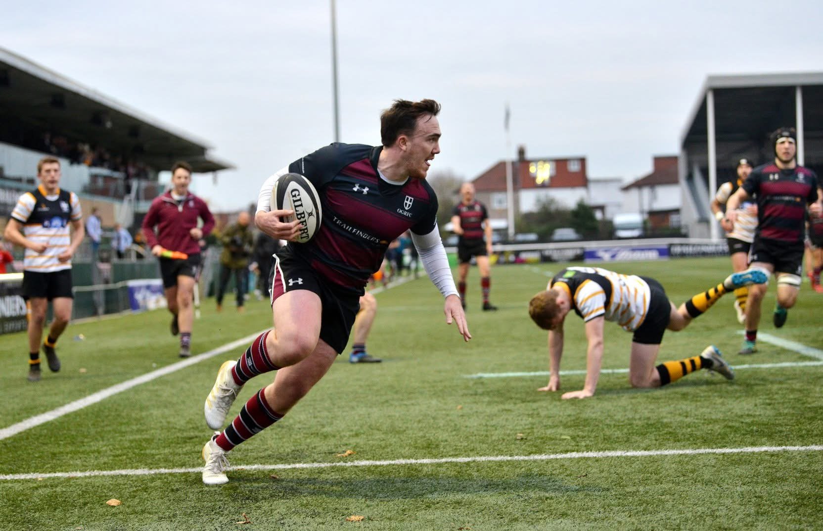 Eoghan Sweeney breaks through a tackle to score a try whilst playing for OGRFC Weybridge