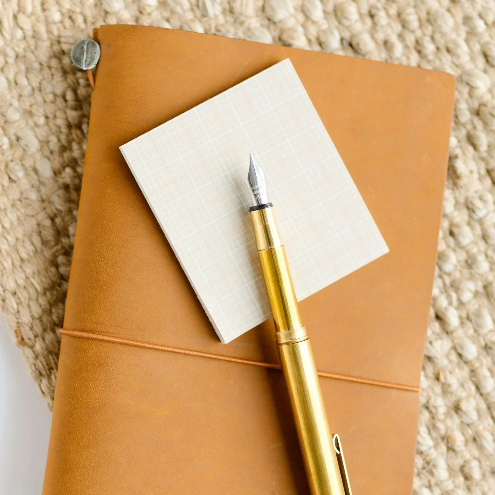 Leather journal and pen representing Katie Hardie's accounting experience and credentials