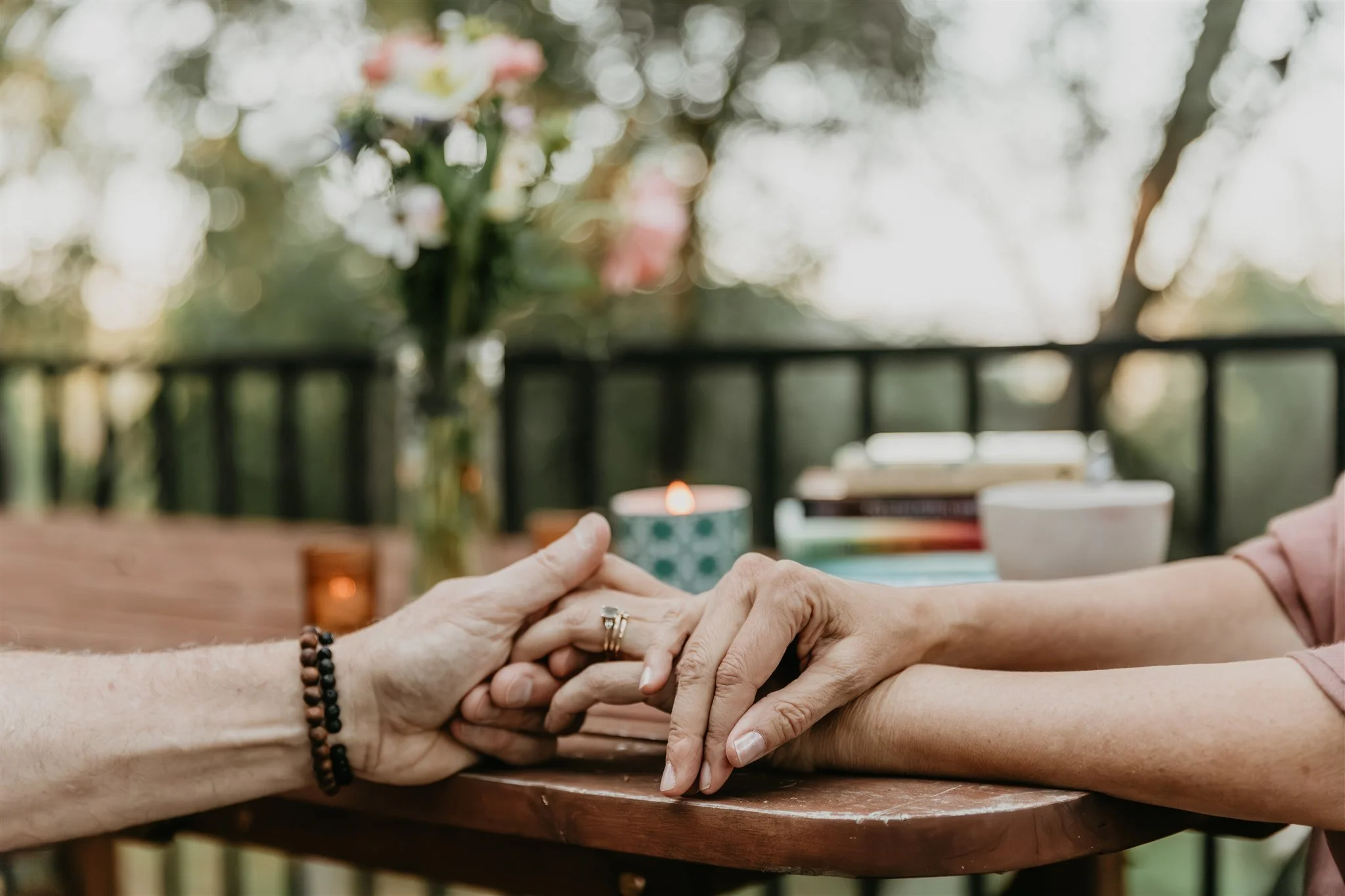 Close-up of two hands in a supportive relationship
