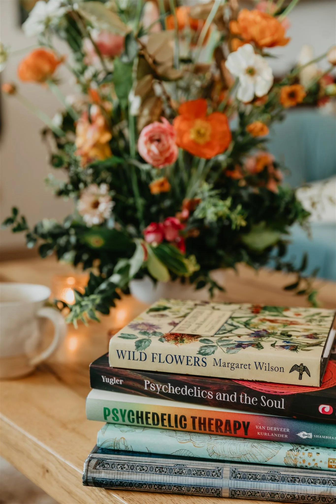 Books on psychedelic therapy and healing in Rachael Courtier’s therapy office