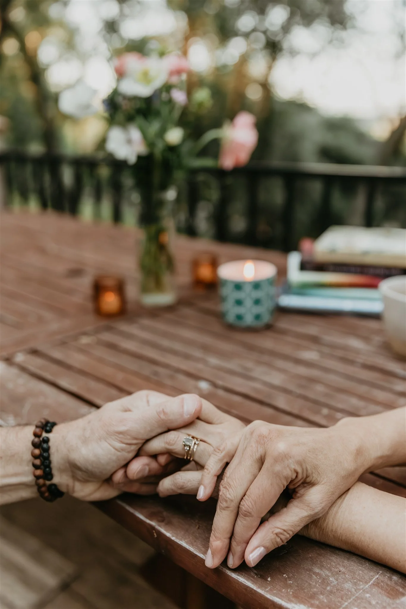 Close-up of supportive hands during a therapy session for attachment-based healing