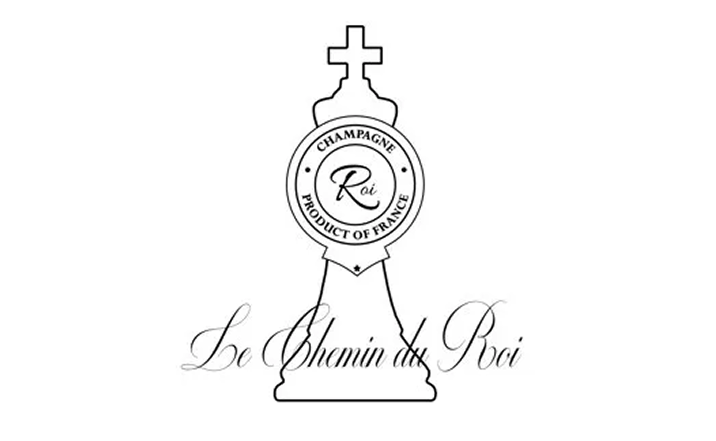 A logo featuring a chess piece with a cross on top, with the text 'Champagne Roi Product of France' inside a circle, and the words 'Le Chemin du Roi' written in cursive below.