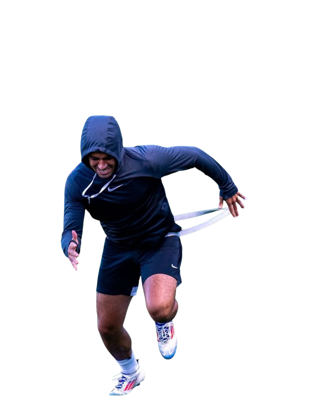 Male athlete in a navy blue hoodie and shorts, wearing white sneakers, running with a prosthetic leg.