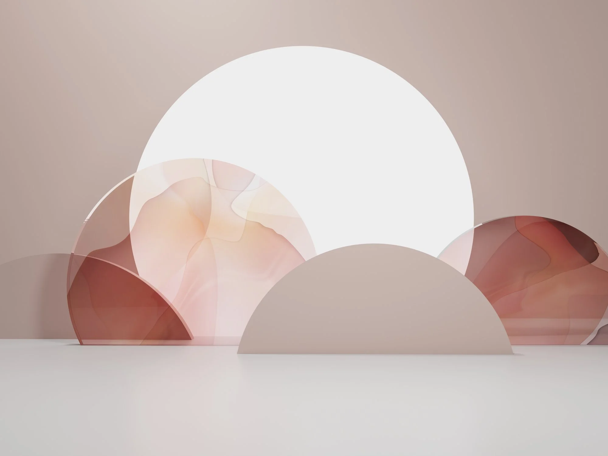 Abstract art installation with overlapping semi-transparent circular shapes in shades of beige, white, and reddish-brown on a neutral background.