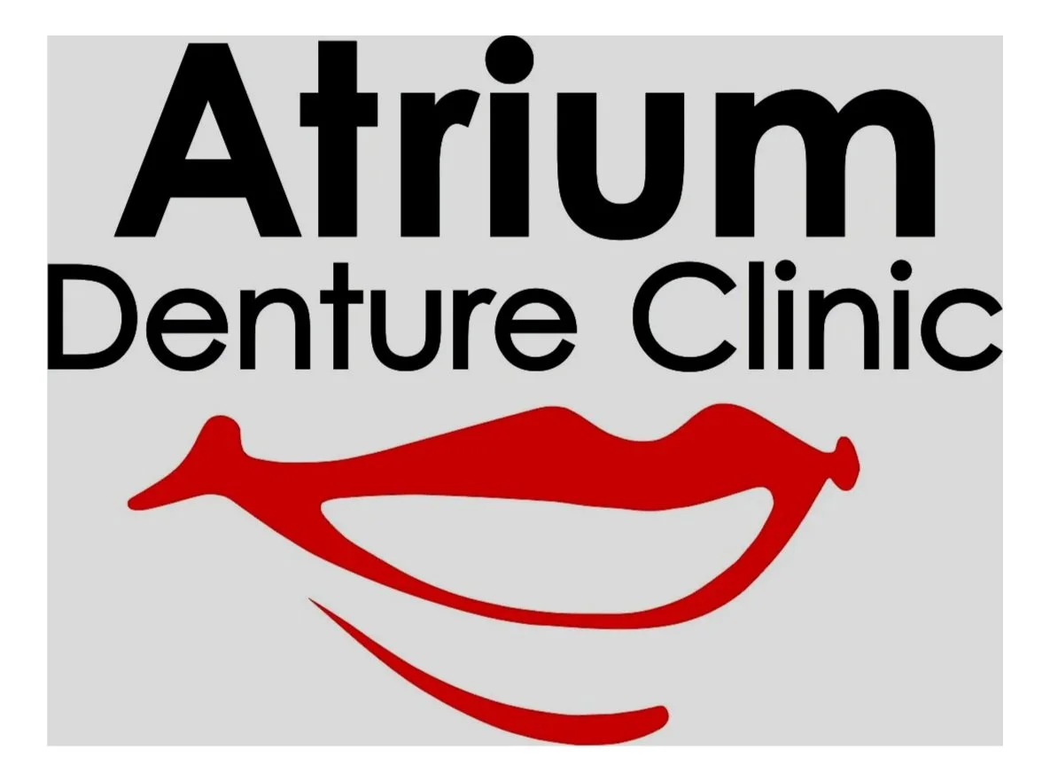 Logo for Atrium Denture Clinic with black text and a red stylized smile design on a light gray background.