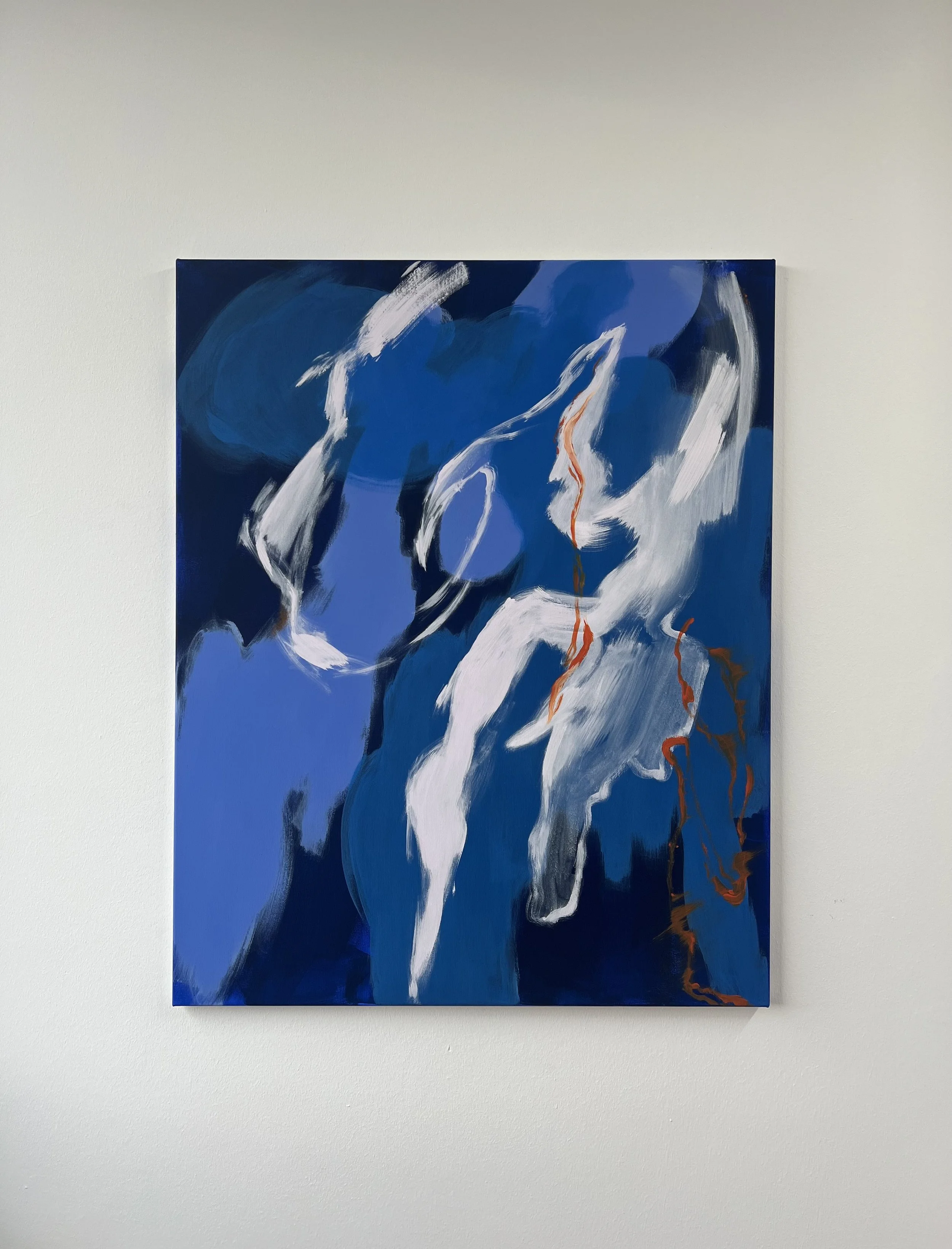 Abstract blue and white painting with hints of orange, displayed on a white wall.