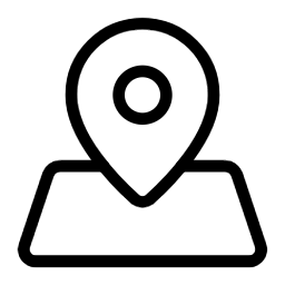 Silhouette of a person performing a handstand on a beach at sunset.