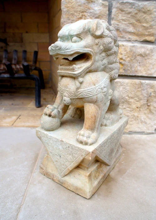 Right: Close up of lion statuary.