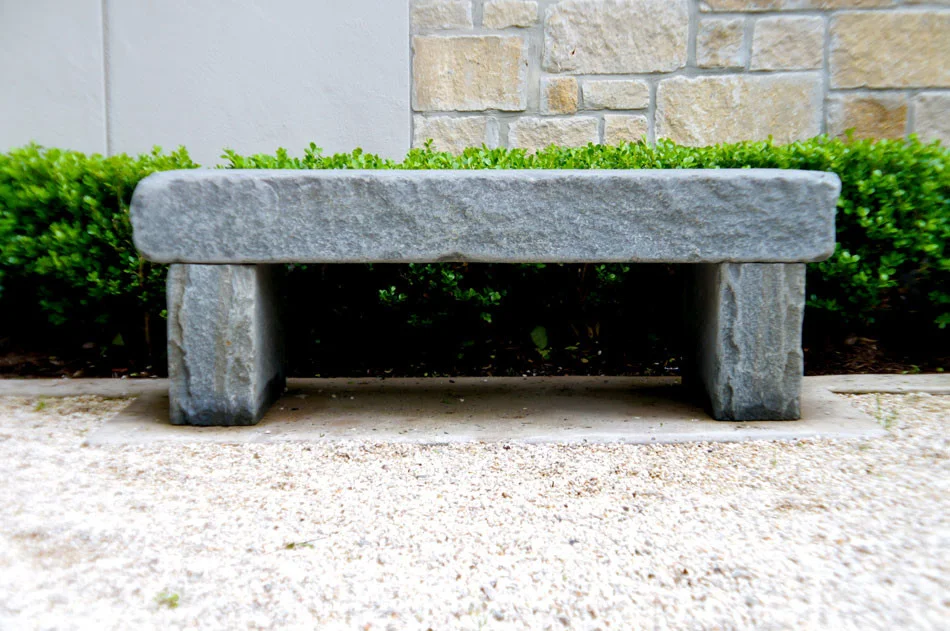 Custom stone bench mirrors another identical one in this french entryway.