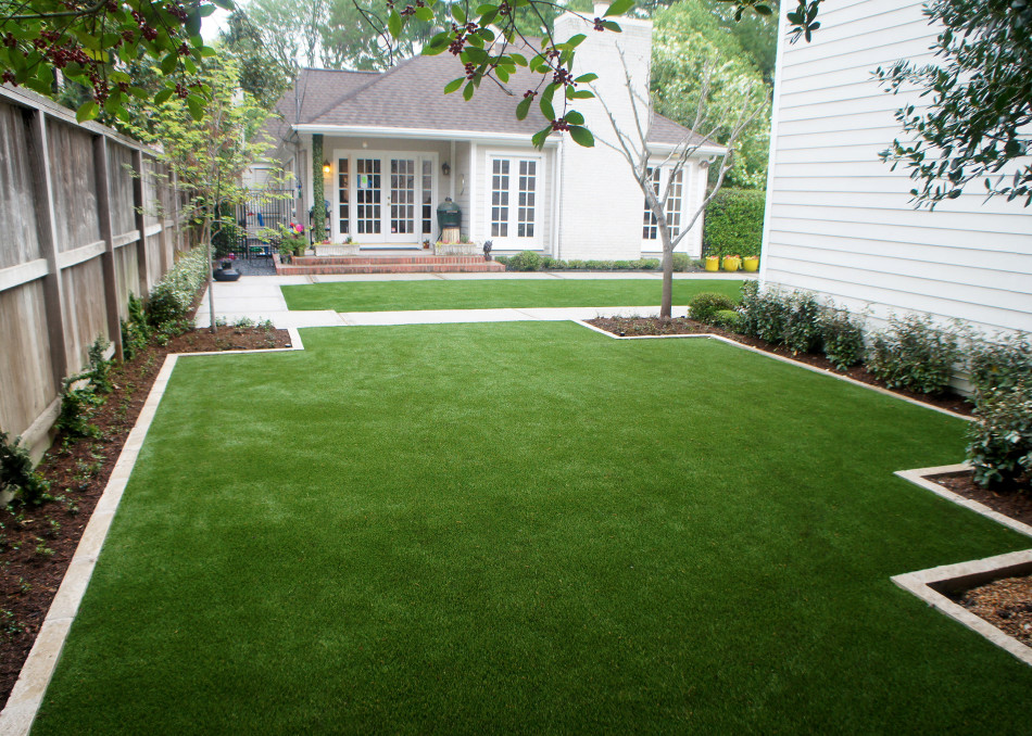 Paving with clean lines and artificial turf replace what was muddy, underutilized space.
