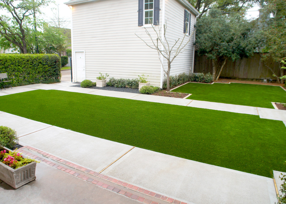 A concrete walk frames the children's play lawn and offers a path for bikes.