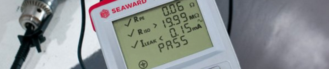 SEAWARD digital device displaying test results for Rpe, Riso, and leak, all marked as pass.