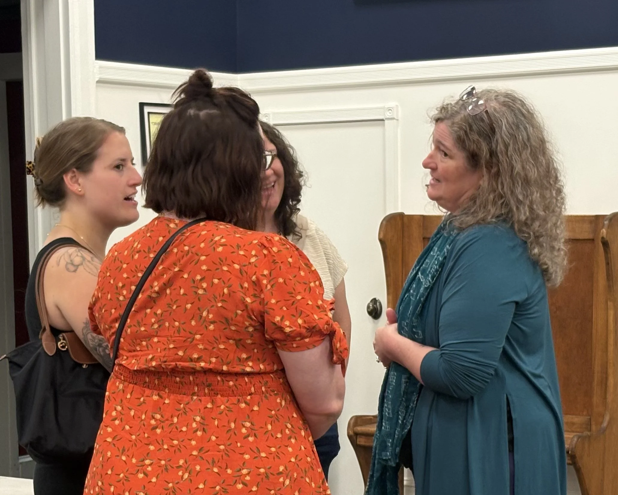 Laurel talking to a group of people