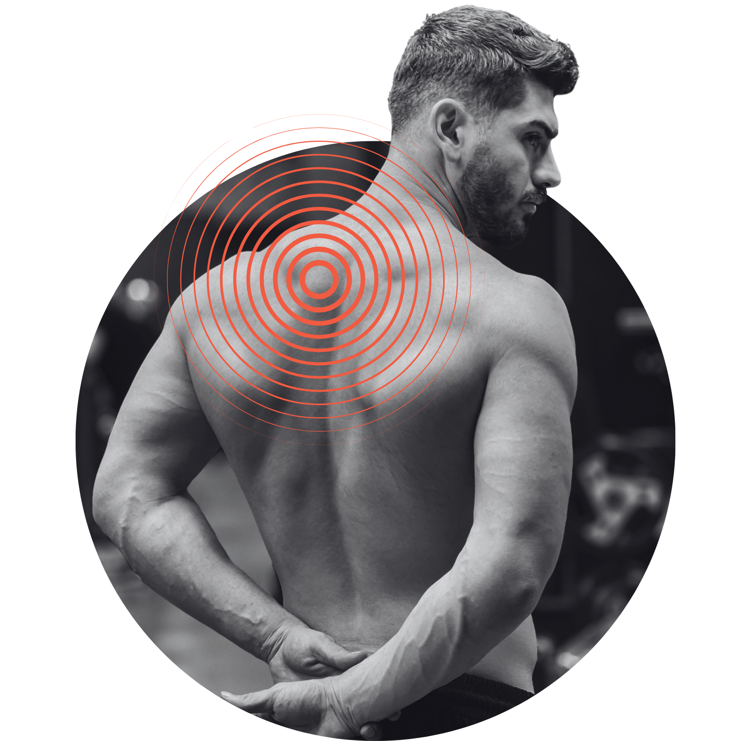 Black and white photo of a shirtless man with a beard and short hair, looking to the right, with red concentric circle graphic on his back, and a blurred gym background.