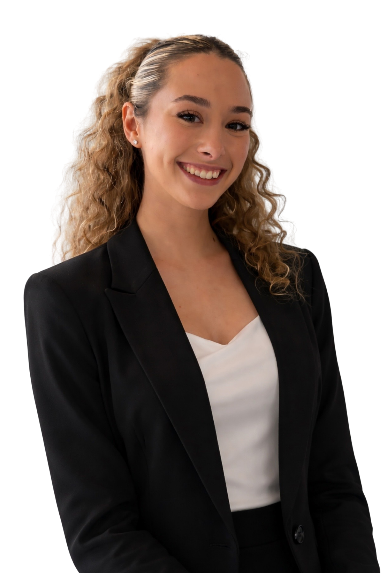 A young woman with long curly blonde hair wearing a black blazer over a white top, smiling and looking at the camera.