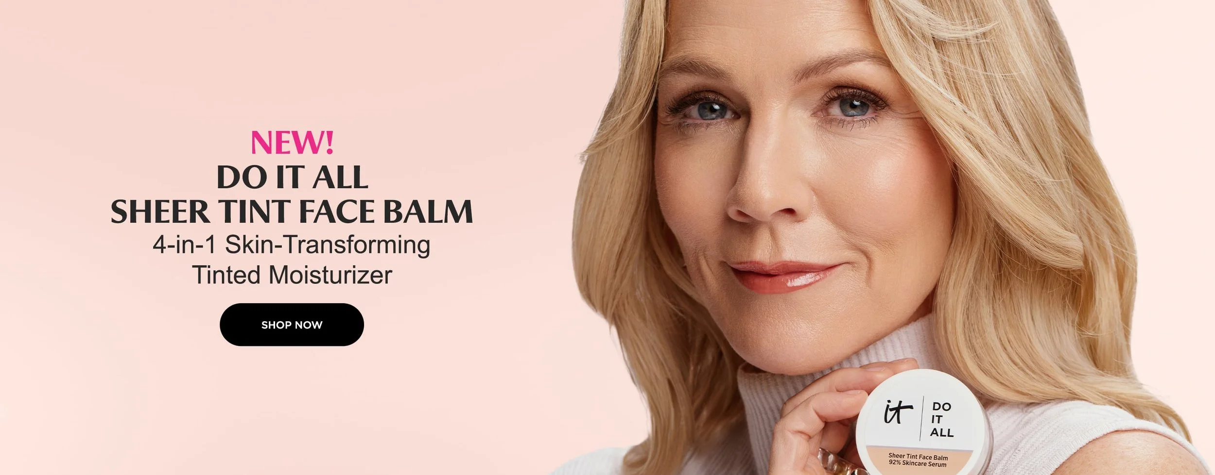 A woman with blonde hair and blue eyes holding a container of sheertint face balm, smiling gently, with a pink background and promotional text about the new skincare product.