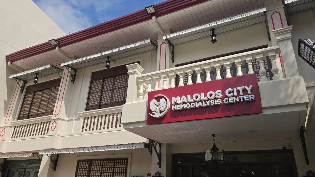 The exterior of Malolos City Hemodialysis Center building with a sign and balcony.