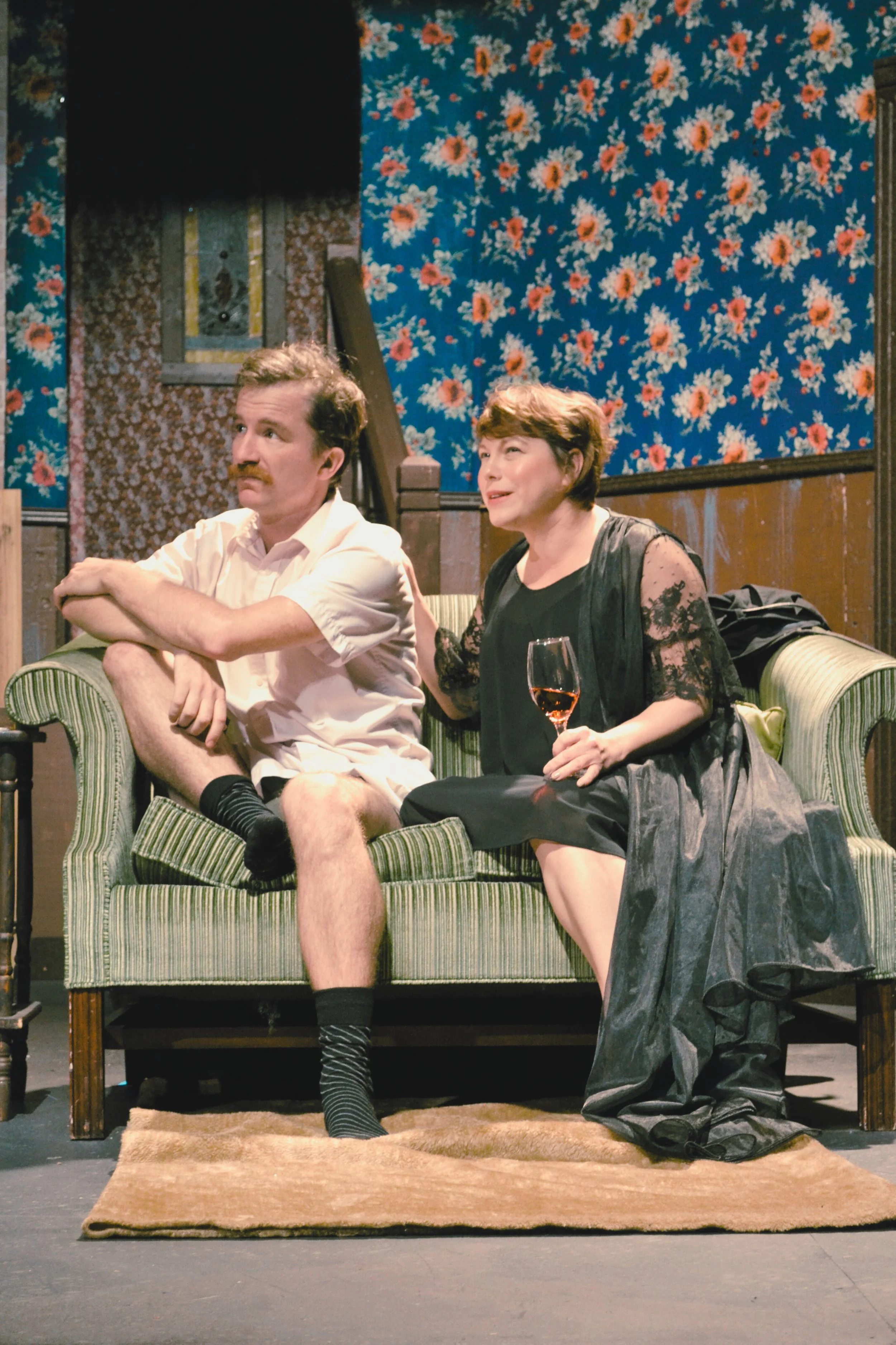 Clifford and Ginny Haverton, played by Marty Jellison and Samantha Scott Kennedy, sit on a couch discussing their future.