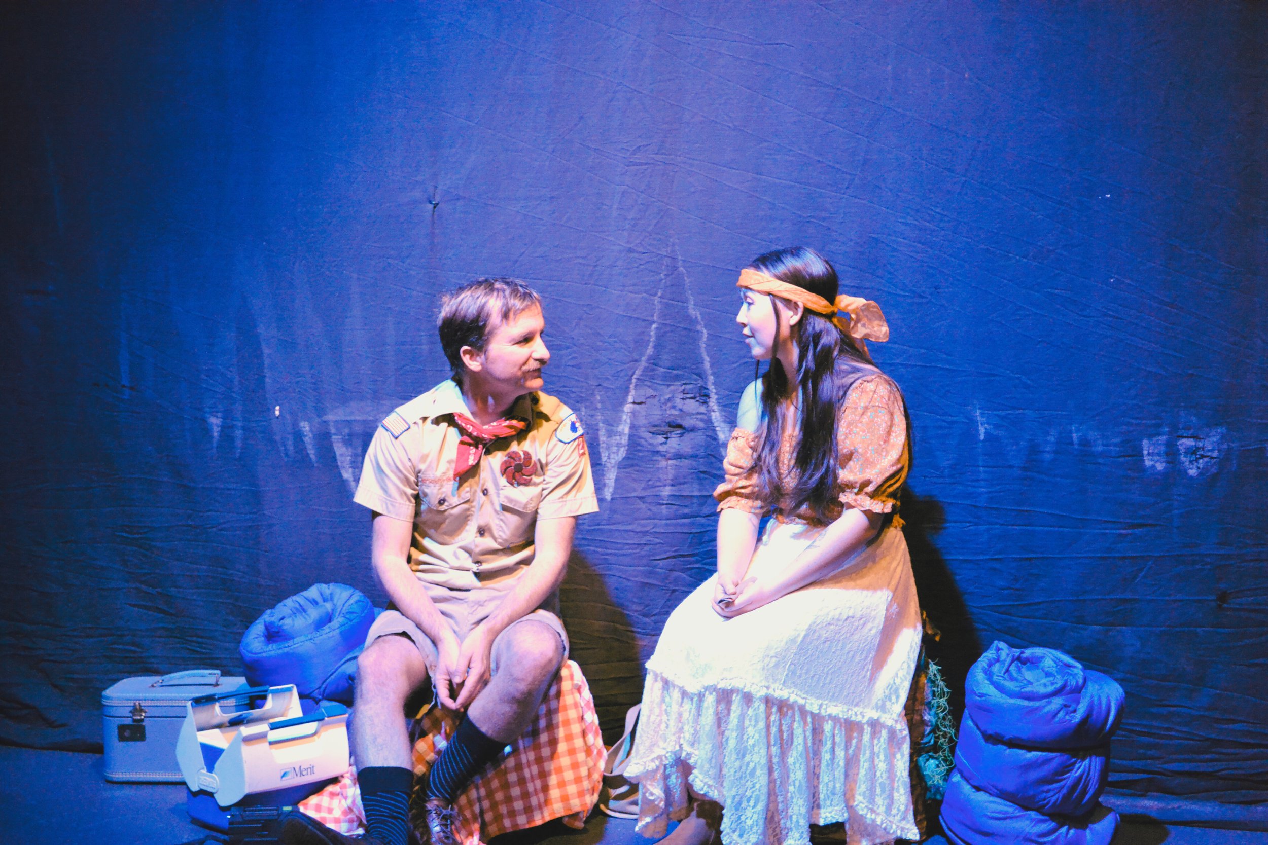 Cliff and Bea, played by Marty Jellison and Morganne Chu, sit fireside and discuss life.