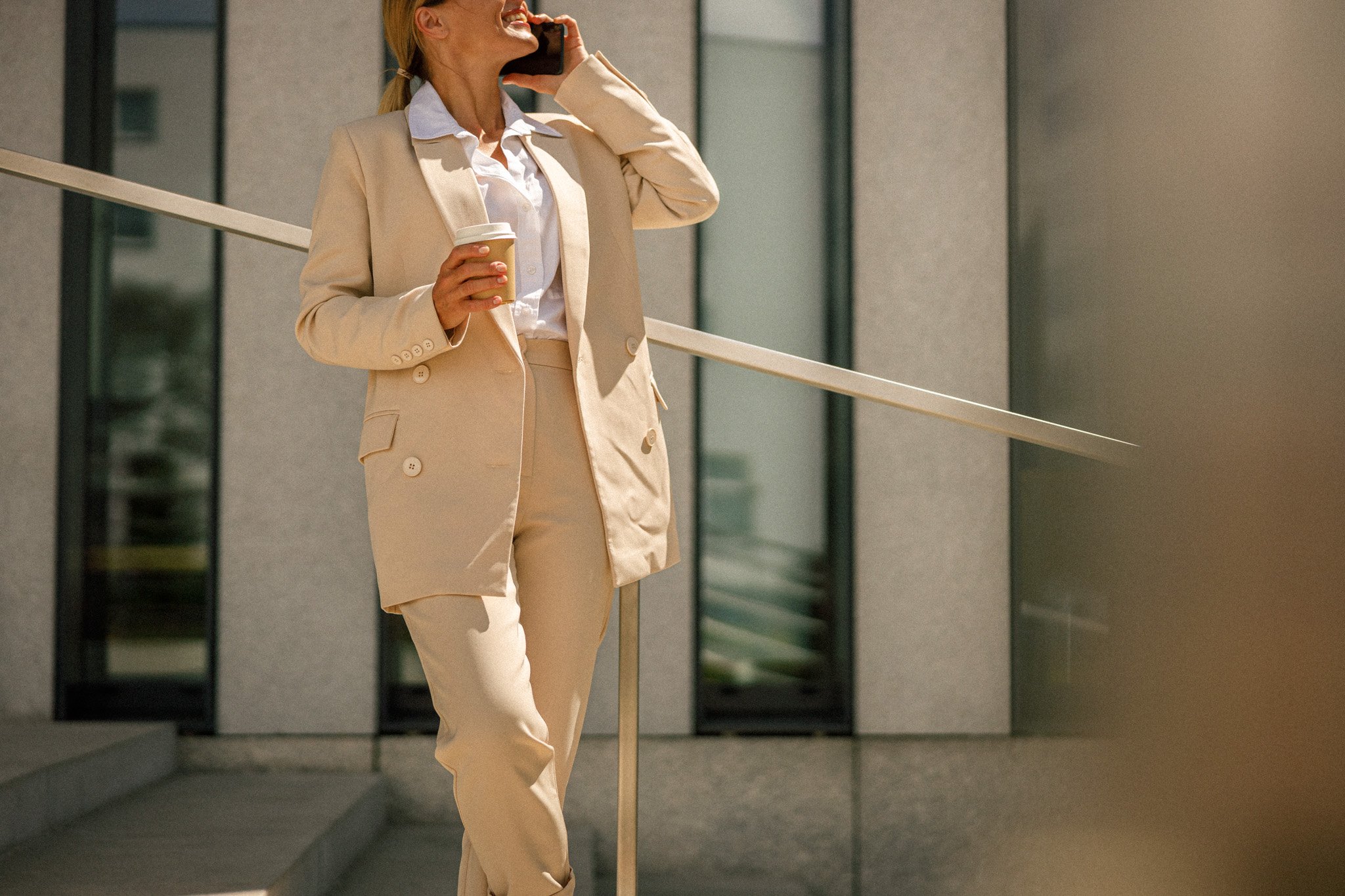 close-up-of-business-woman-talking-phone-whiile-st-2023-11-27-04-57-22-utc-2.jpg
