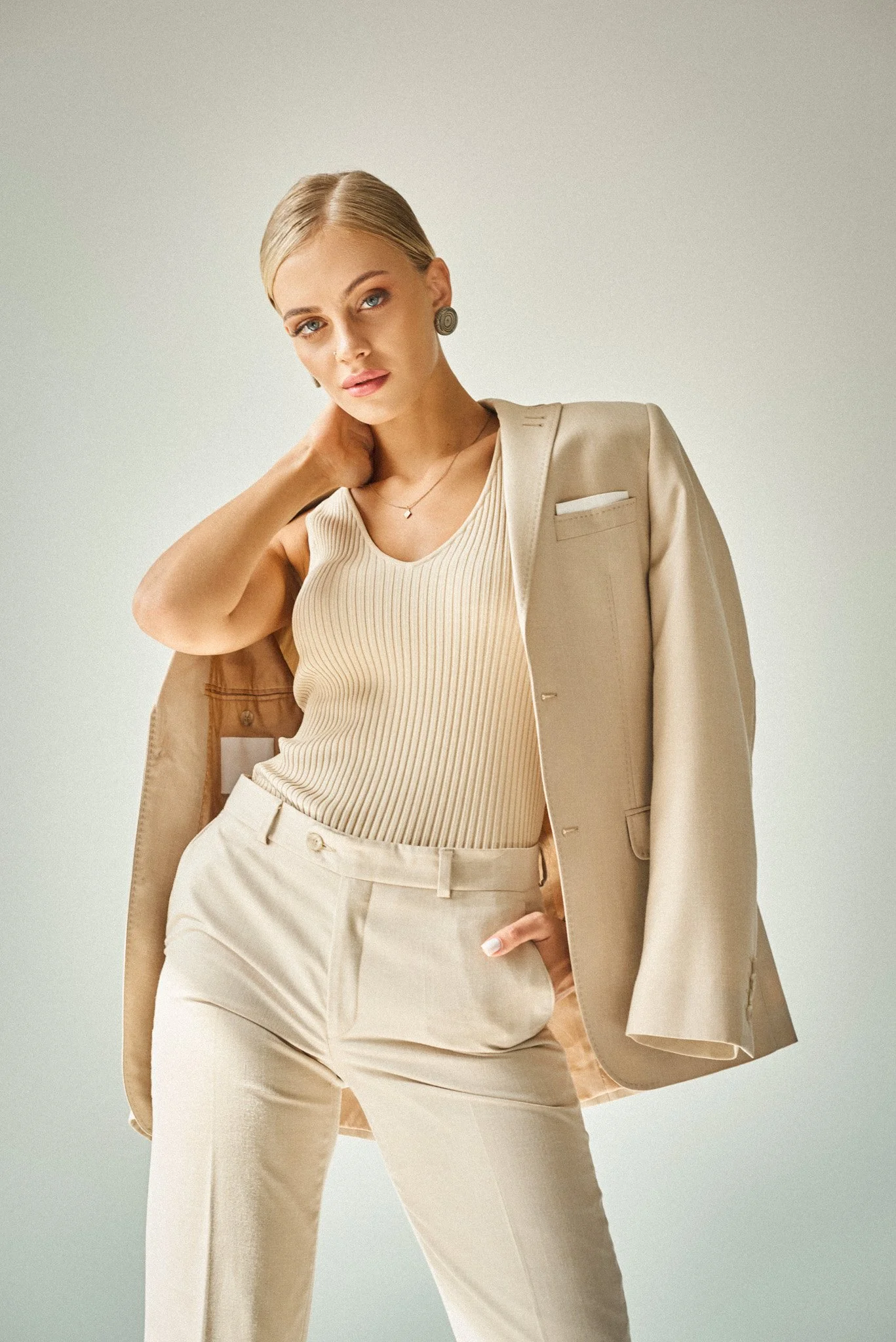 young-fashion-model-in-stylish-beige-clothes-touch-2023-11-30-19-53-13-utc-2.jpg
