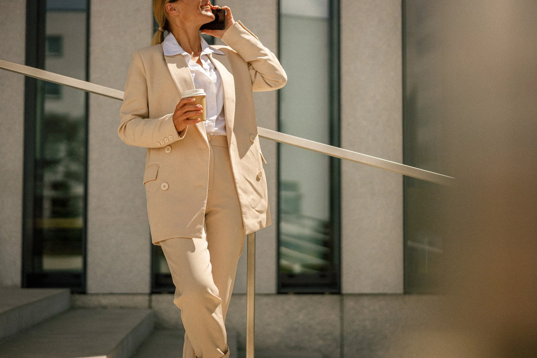 close-up-of-business-woman-talking-phone-whiile-st-2023-11-27-04-57-22-utc-2.jpg
