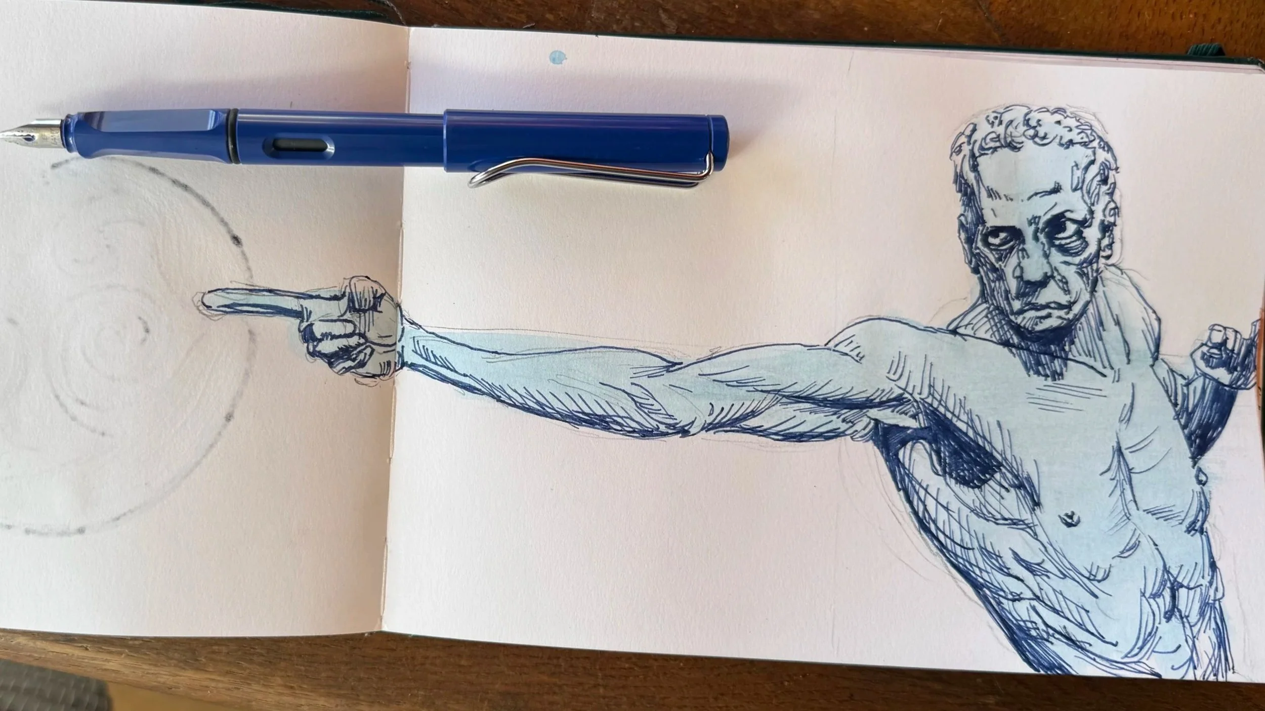 A blue ink sketch of a muscular man with curly hair pointing with his right arm, with a neutral background featuring a faint circle.