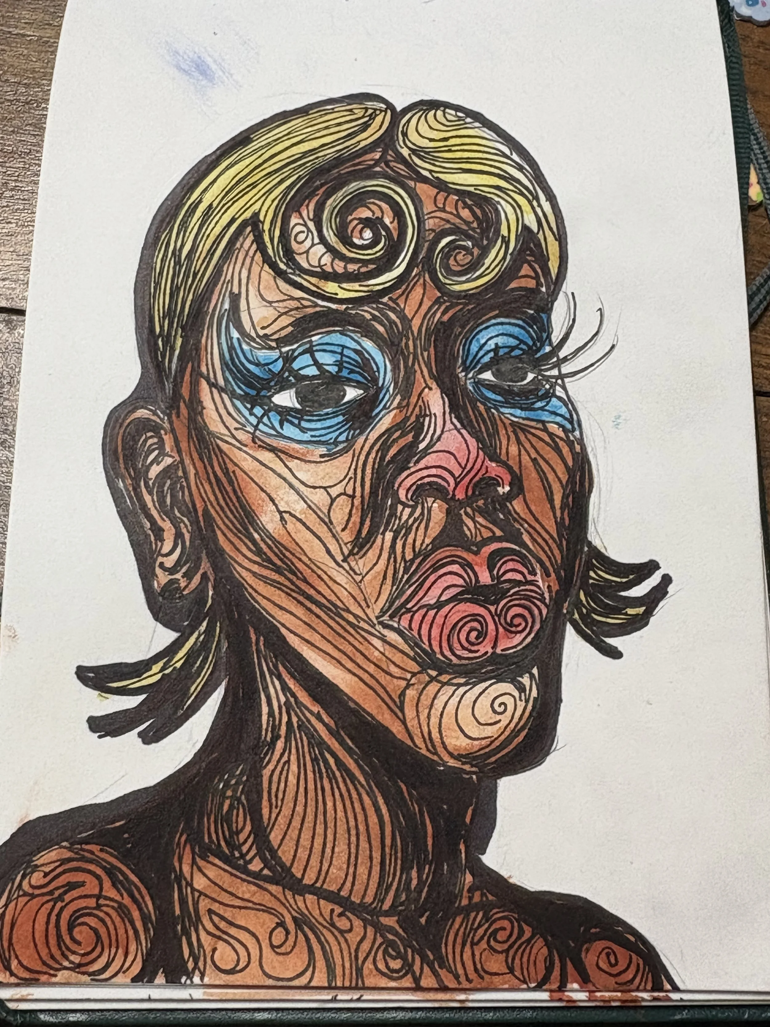Colorful abstract sketch of a woman with swirling hair and facial features, including eyes, nose, and lips, rendered with multicolored lines and shading.