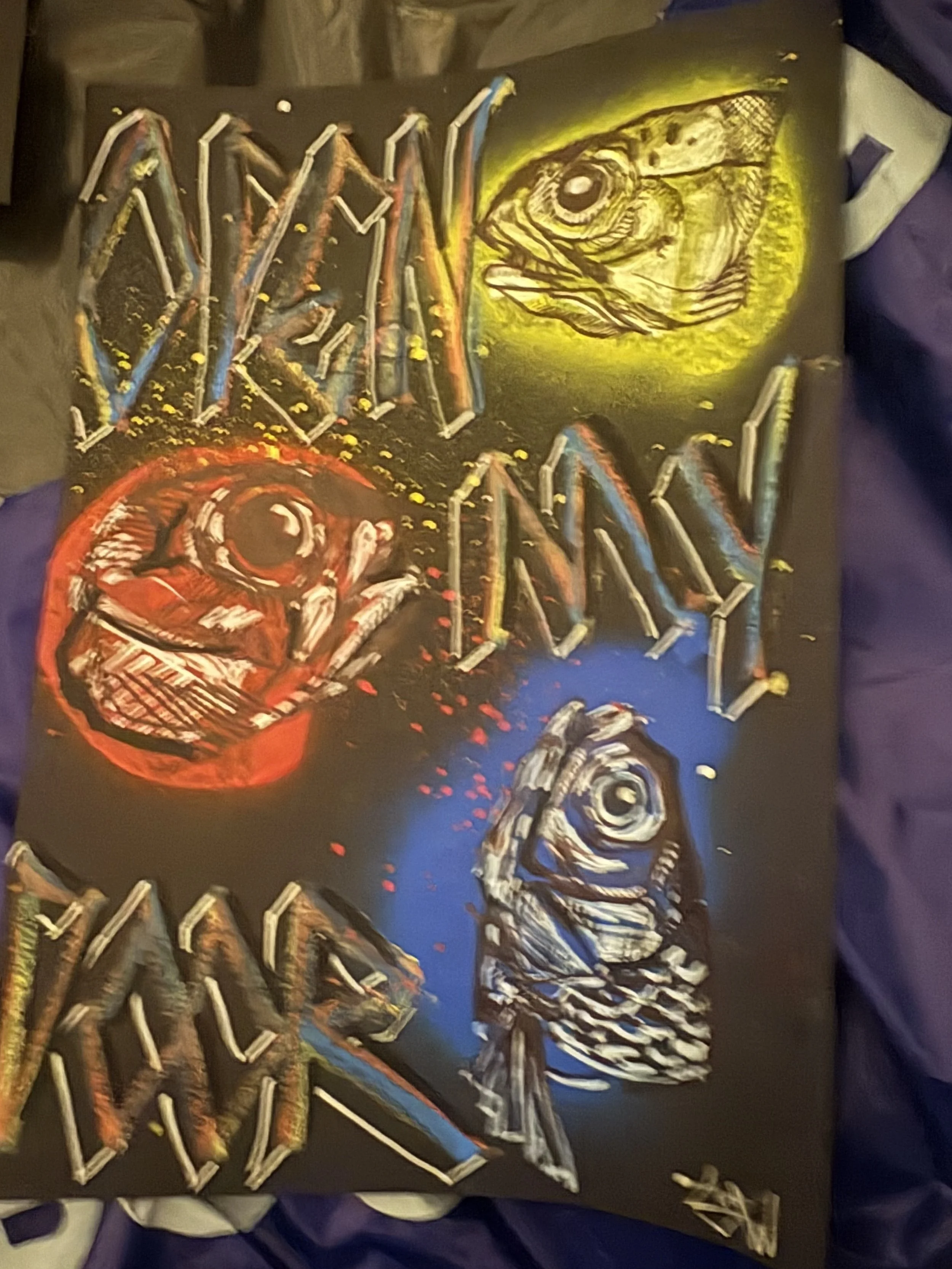 Graffiti-style artwork featuring a dinosaur head, a circular face, and stylized text on a dark background.