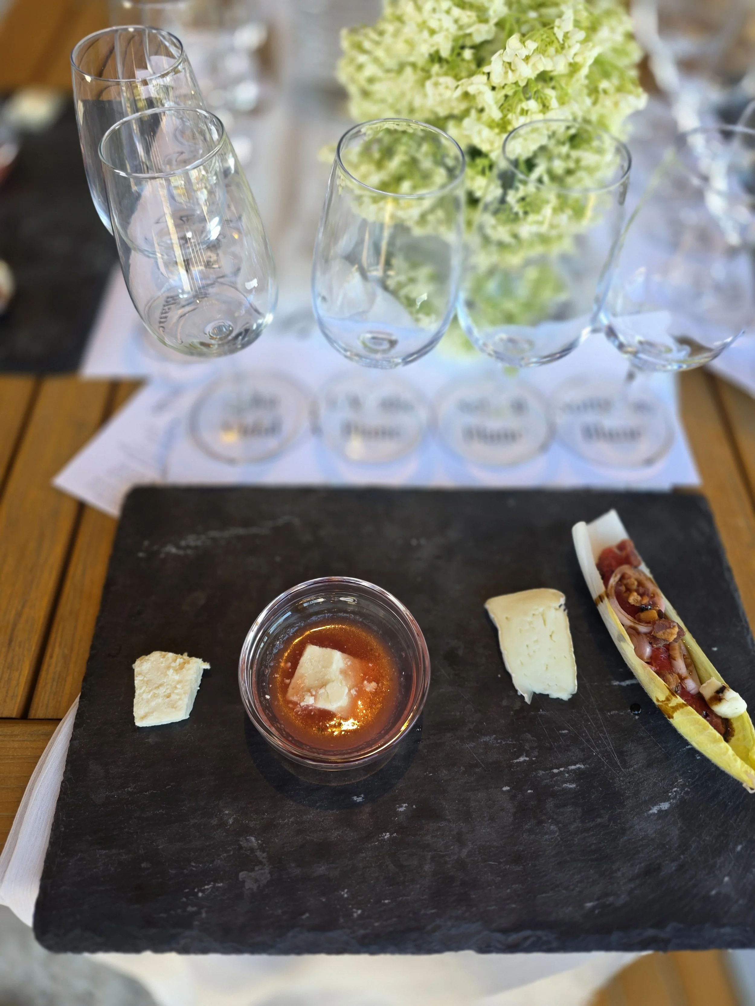 A summer wine and cheese tasting showcase casing white Ontario wine from the Georgian Bay region paired with Natural Pastures Brie from Vancouver Island and a small canape.