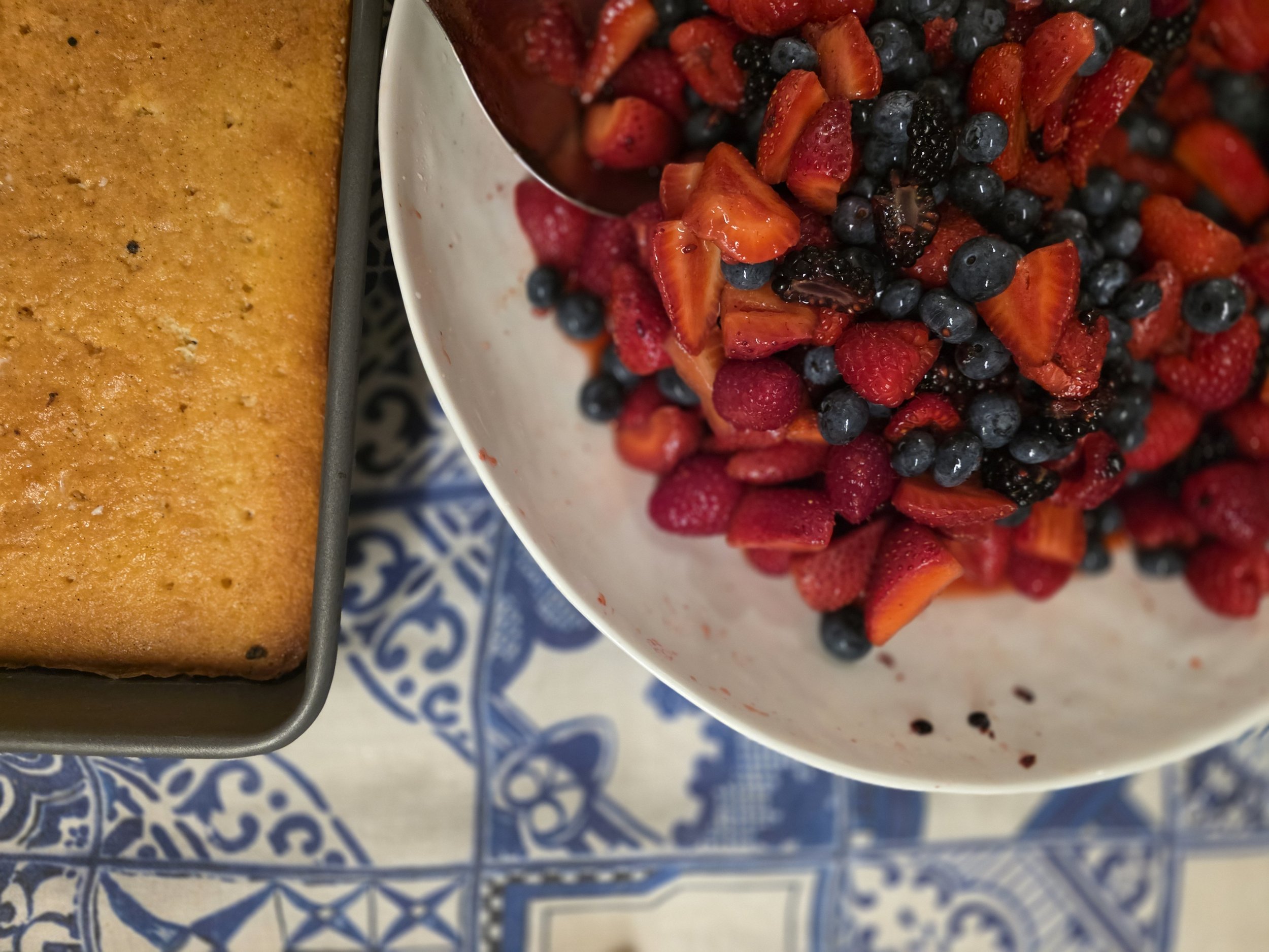 Tres Leches cakes (Three Milk Cake) served with fresh chopped Ontario berries. Cake, Strawberry, blueberry, blackberry, raspberry.