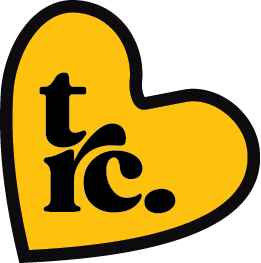 A yellow heart-shaped logo with black text that reads 'trc.'