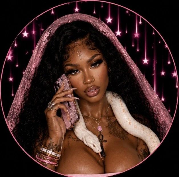 A woman with long, curly black hair wearing a pink veil and jewelry, holding a pink phone to her ear, with a white snake around her shoulders, inside a pink circular frame with hanging stars against a black background.