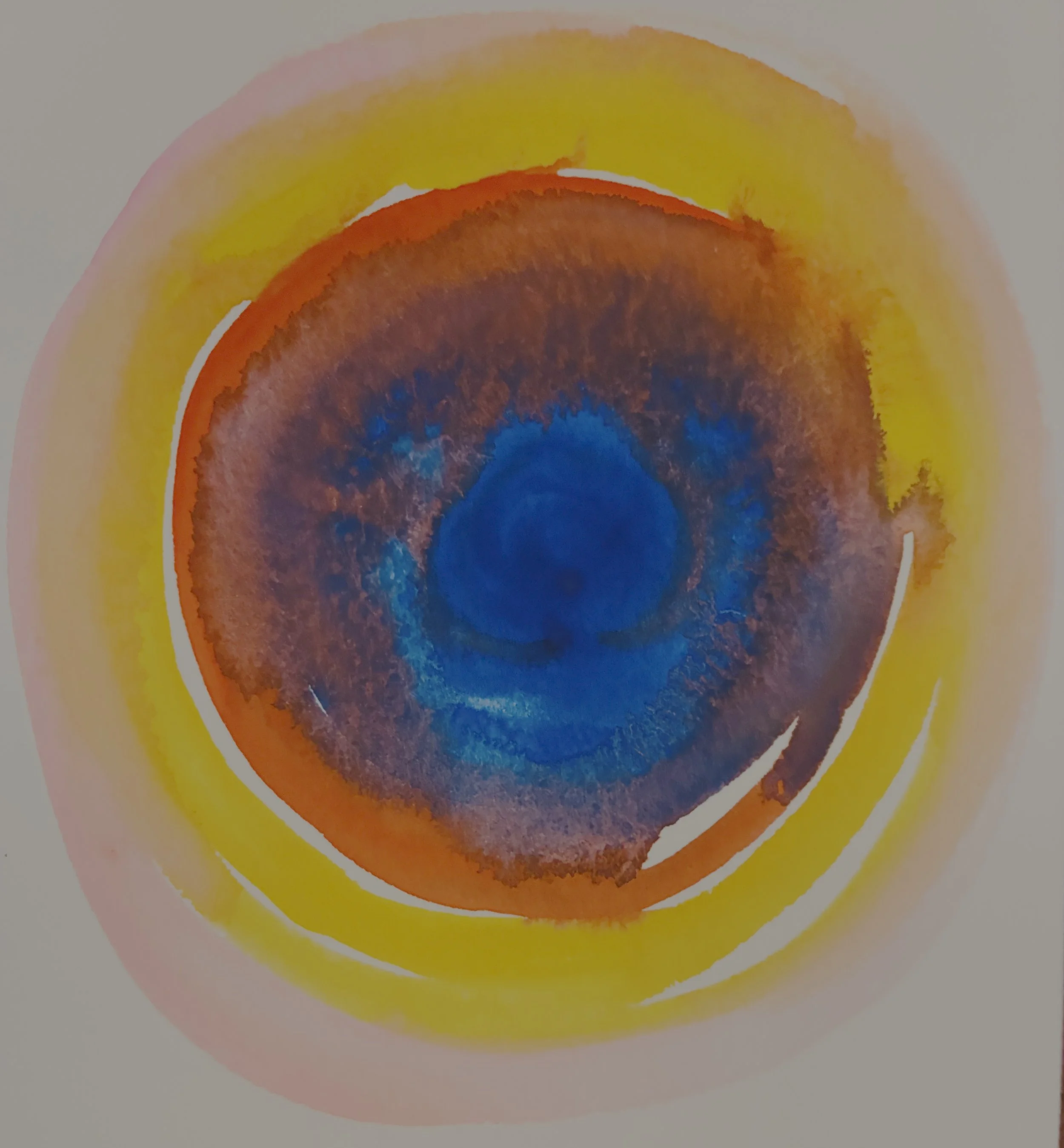 A colorful abstract painting featuring concentric, watercolor washes of circles pooling into each other in shades of goldenrod yellow, peach, red, and indigo.