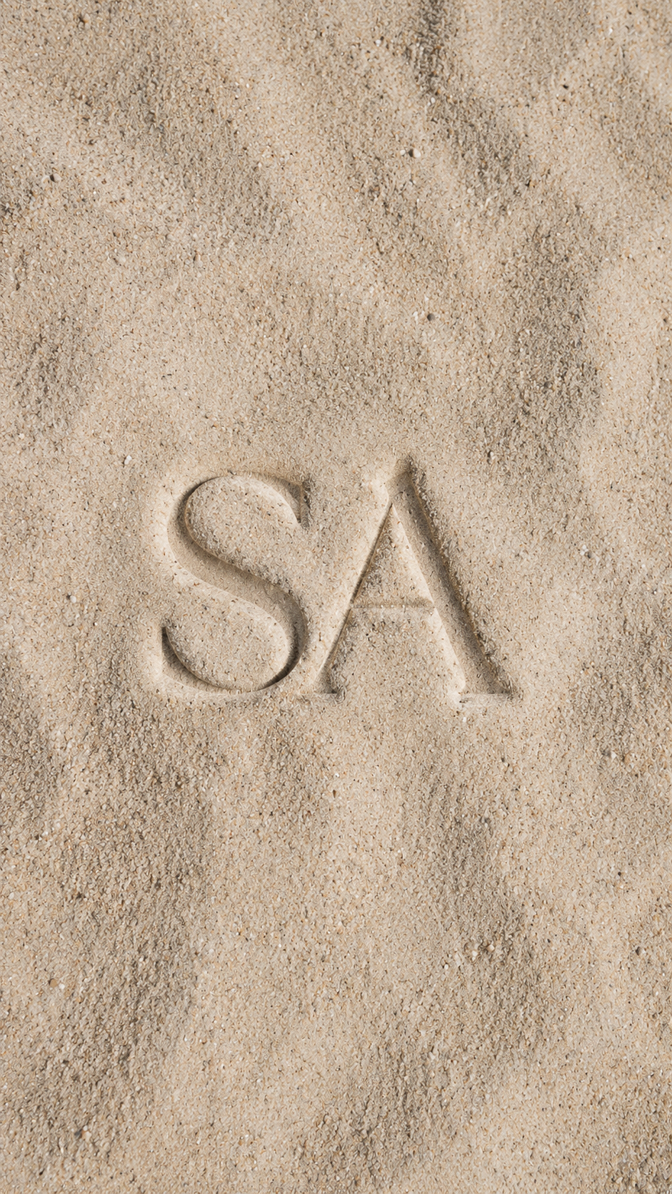 The word "SA" written in the sand.