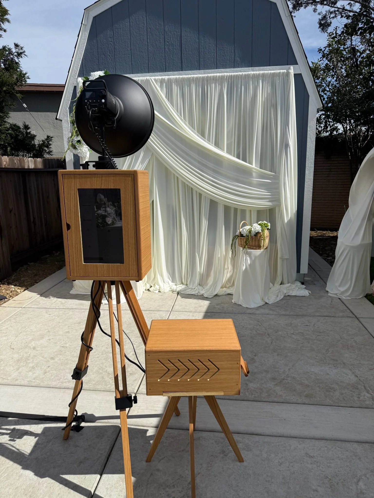 photo booth and draped backdrop.JPEG