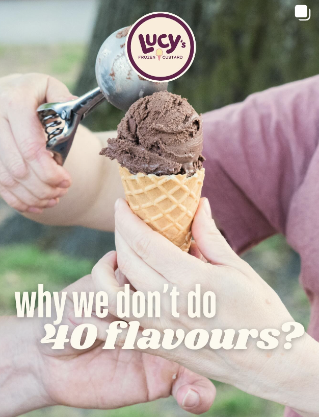 A hand holding a cone of chocolate ice cream with a scoop of ice cream being added from an ice cream scoop, with Lucy's Frozen Custard logo at the top and the text 'why we don't do 40 flavors?' at the bottom. Frozen Custard East Vancouver, BC