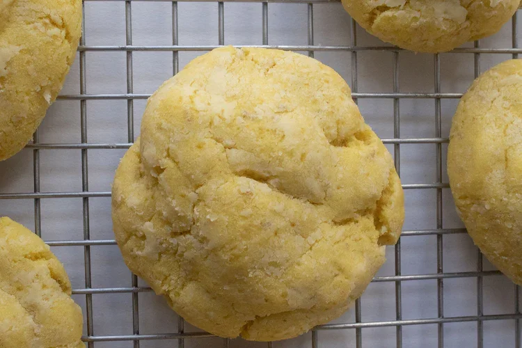 Close-up of a yellow, crumbly cookie on a wire cooling rack. Frozen Custard East Vancouver, BC