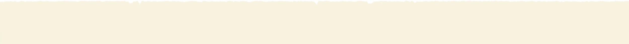 A cream-colored wall with a black frame at the top.