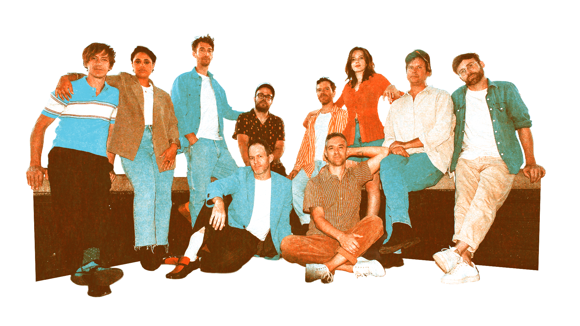 A diverse group of ten young adults posing together, some sitting and some standing, in casual clothing against a white background.