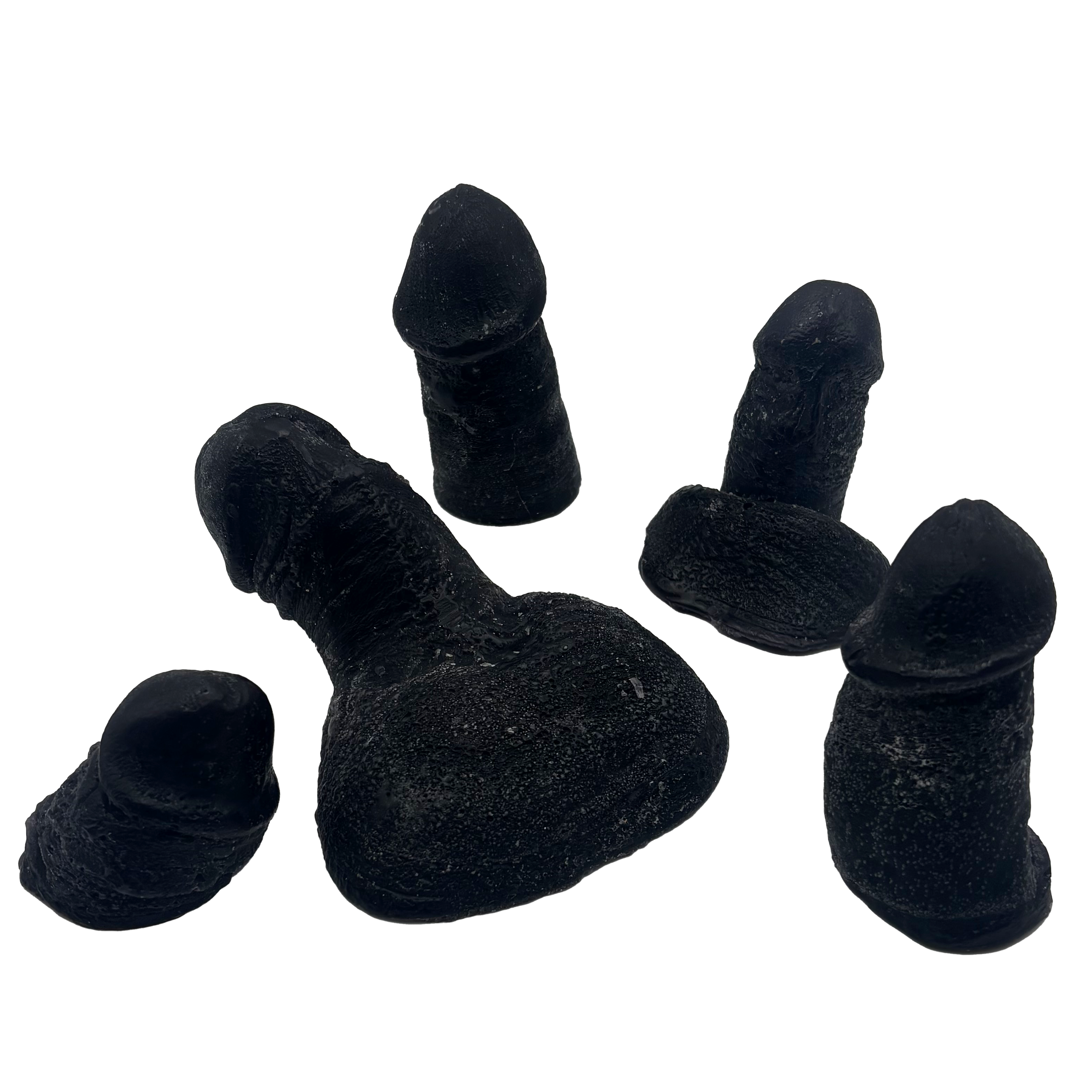 Close-up of black, textured fingers with a shiny surface, holding a dark object. The background is black.
