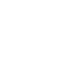 A black and white circular emblem with four clover petals inside.
