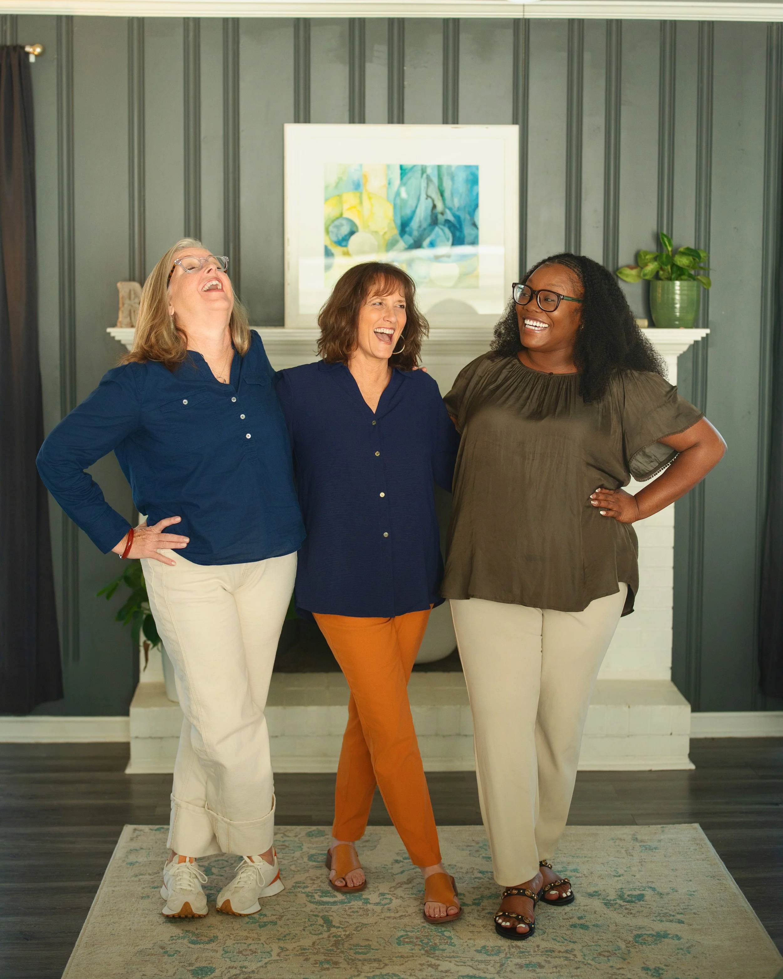 Therapists Holly, Susan and LaShannon laughing.