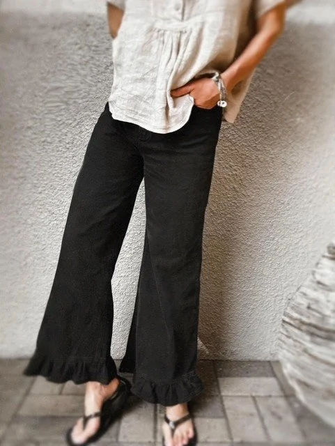Washed black wide-leg denim jeans with frill hem