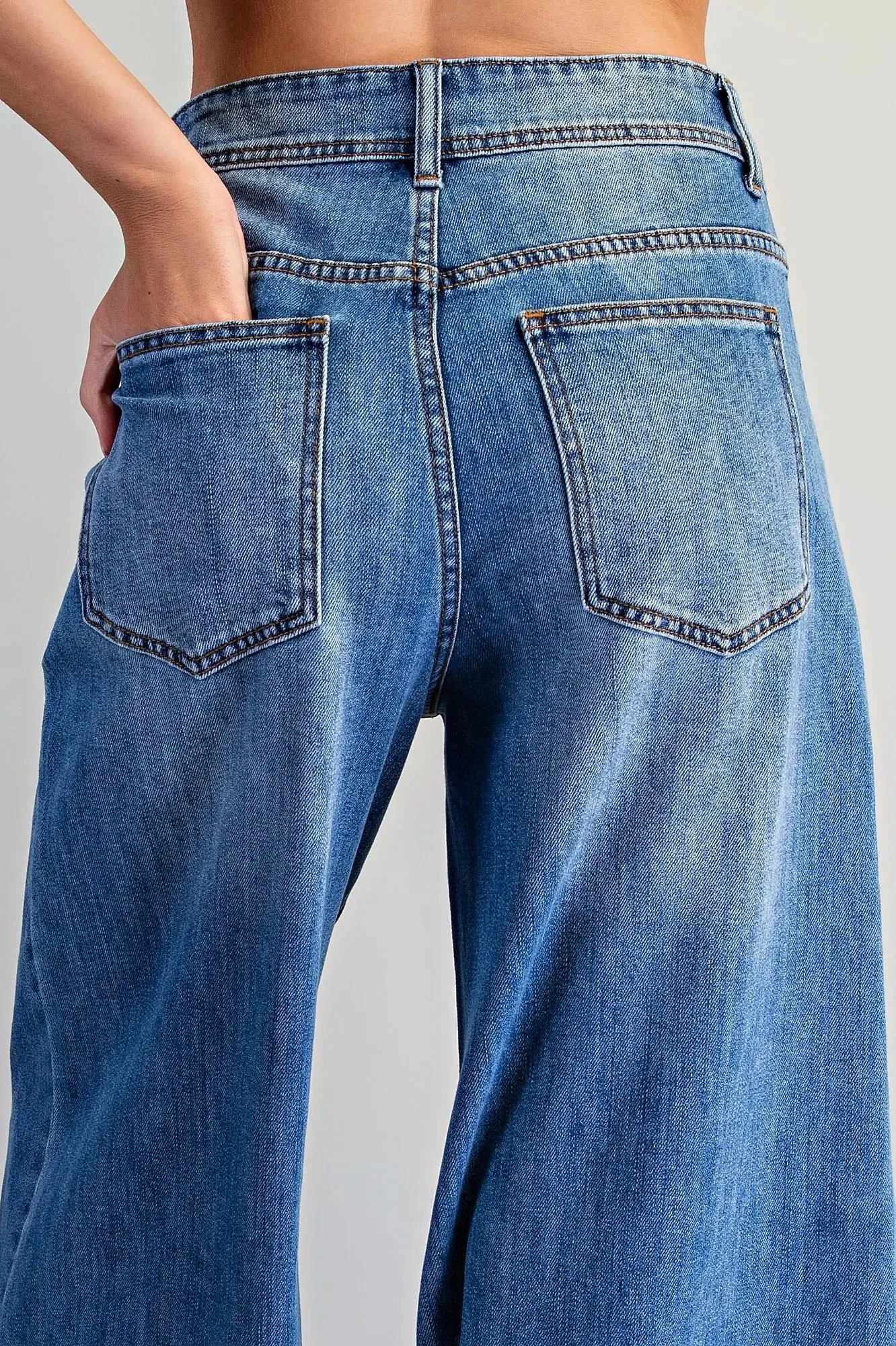Women's wide leg crop jeans showing back pockets and relaxed fit