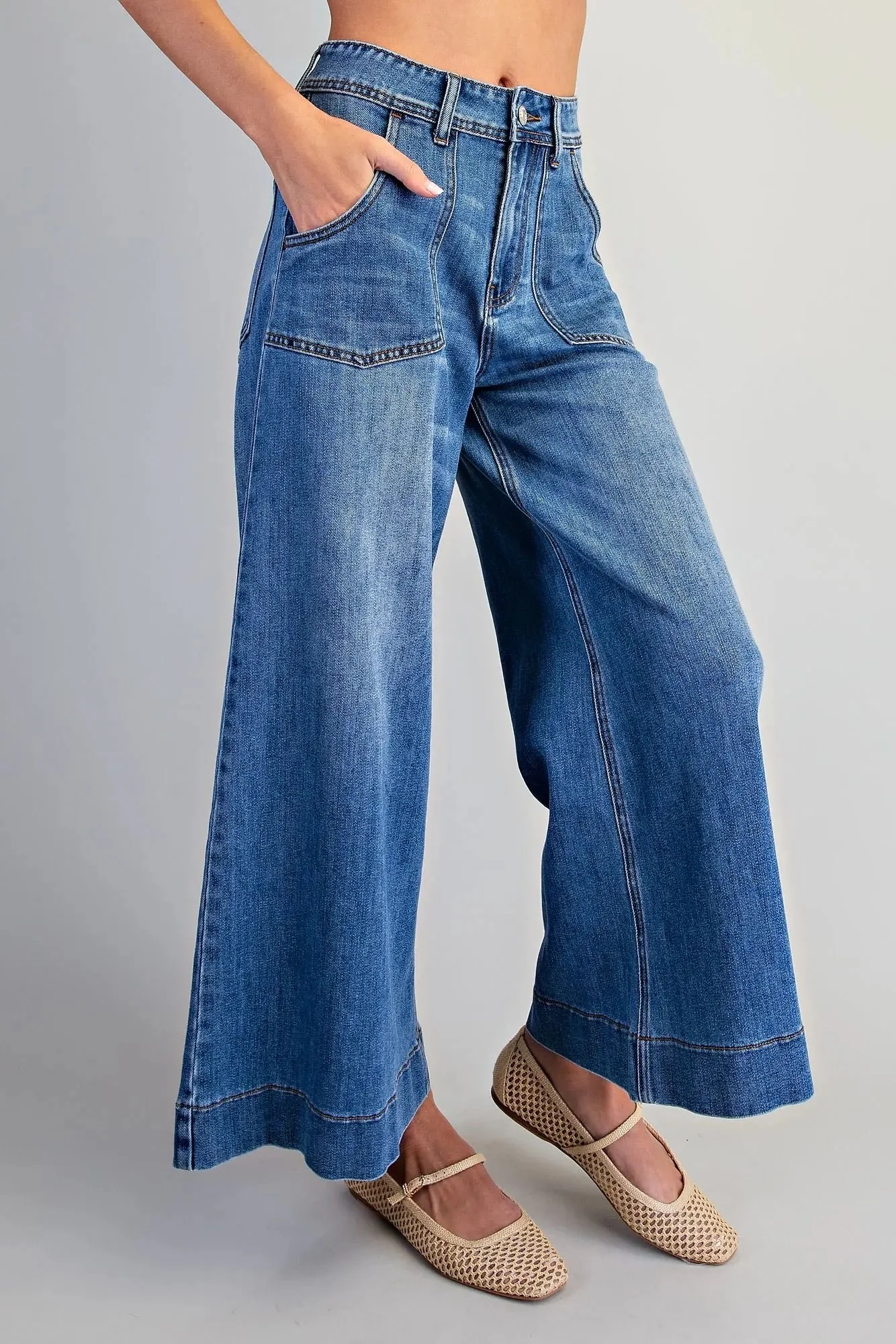 Blue women's wide leg crop jeans showing the wide leg silhouette