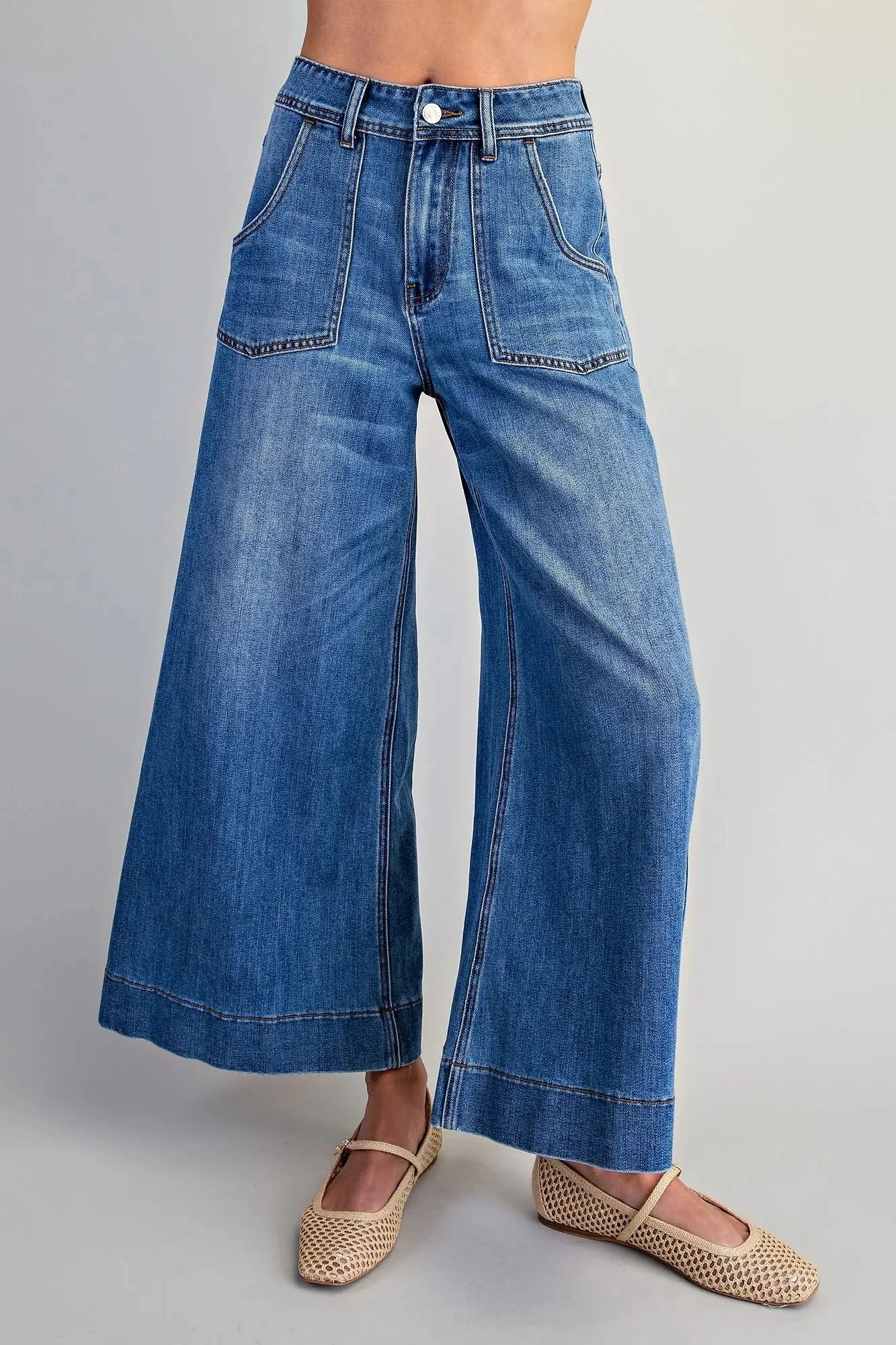 Women's blue wide leg crop jeans showing the full cropped silhouette
