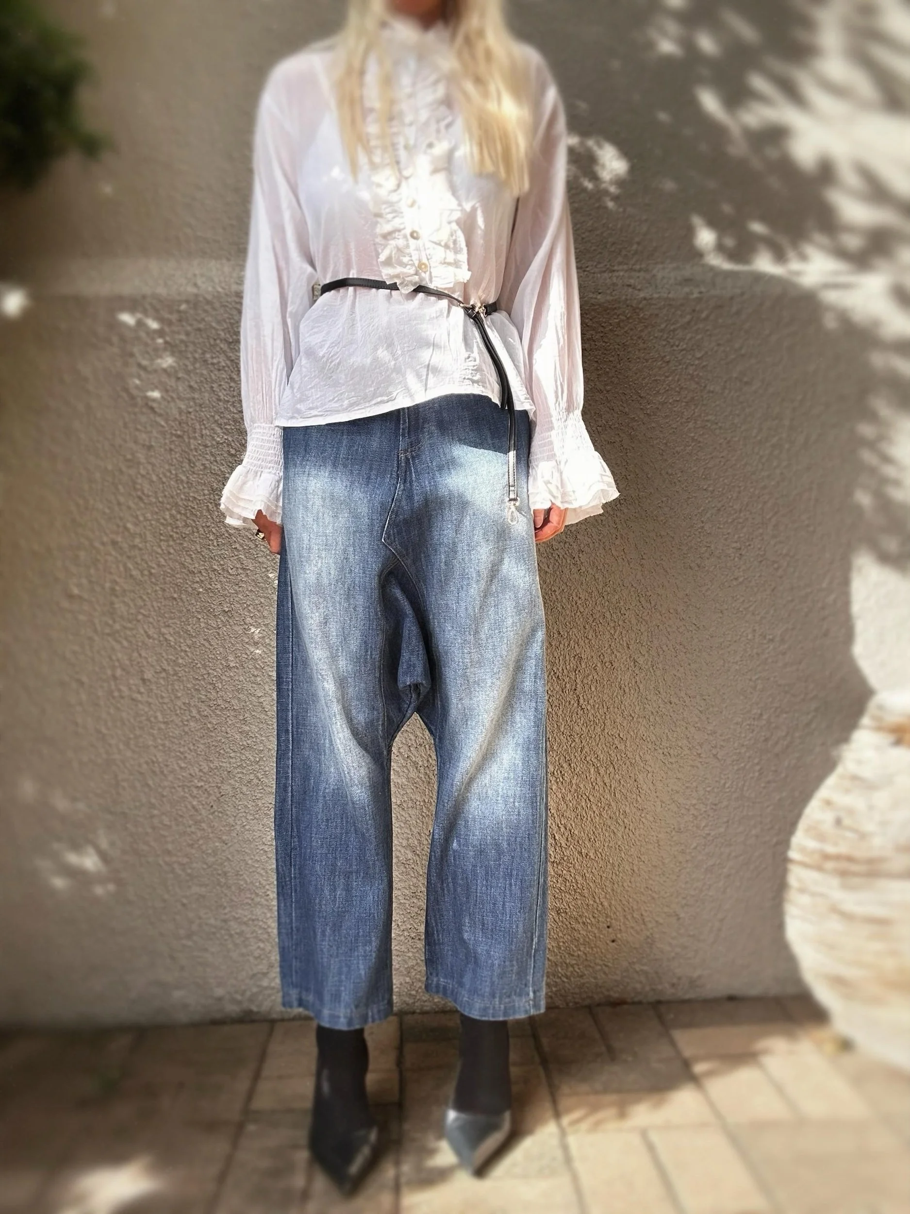 Front view of Banditas Baldwin Harem Jeans featuring vintage-washed blue denim and a relaxed tapered fit.